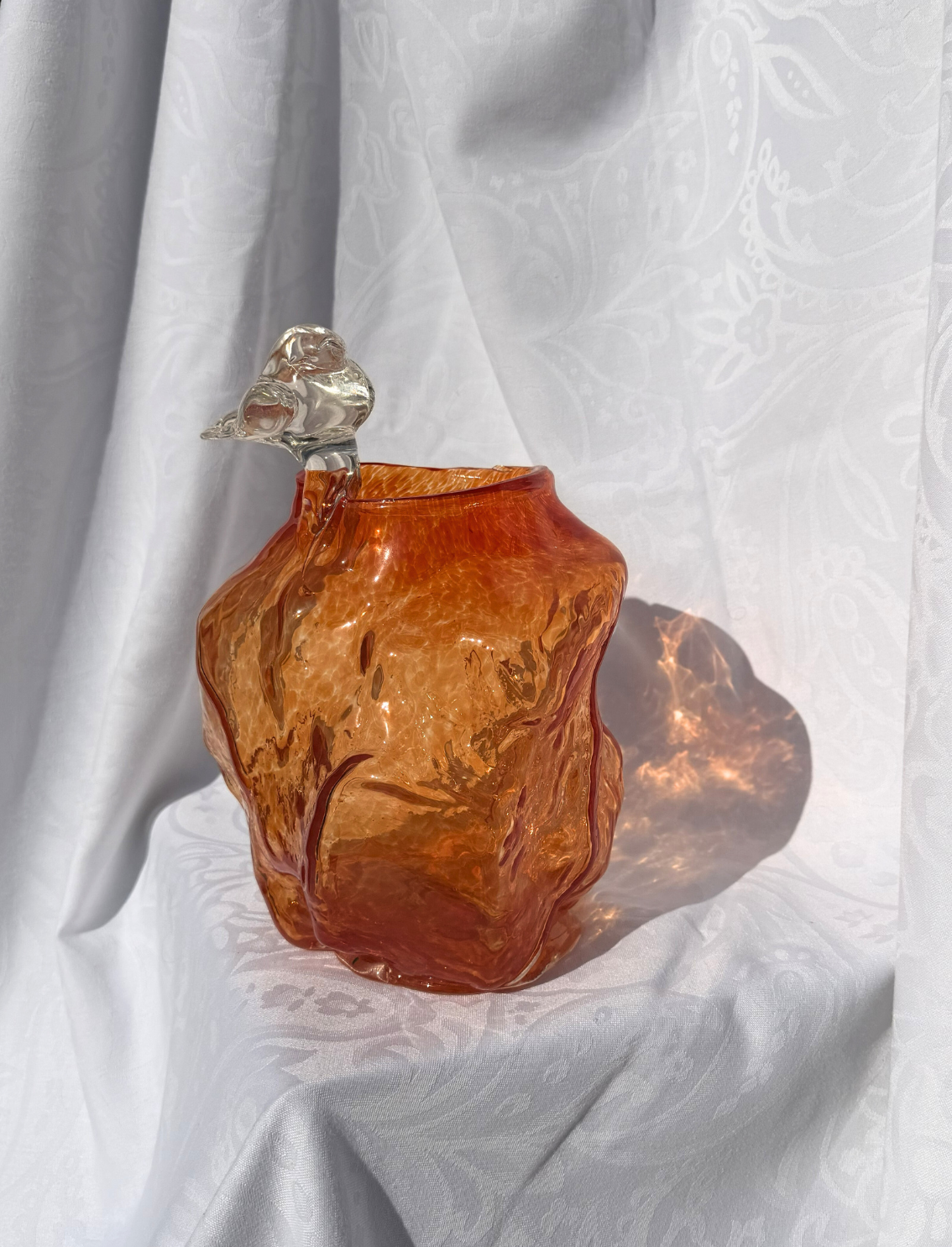 ואזת זכוכית Bird on an Orange Rock
